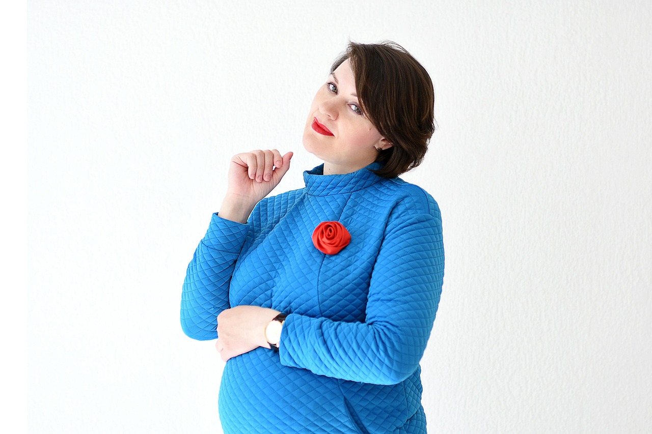 a woman in business, mom, a pregnant business-woman