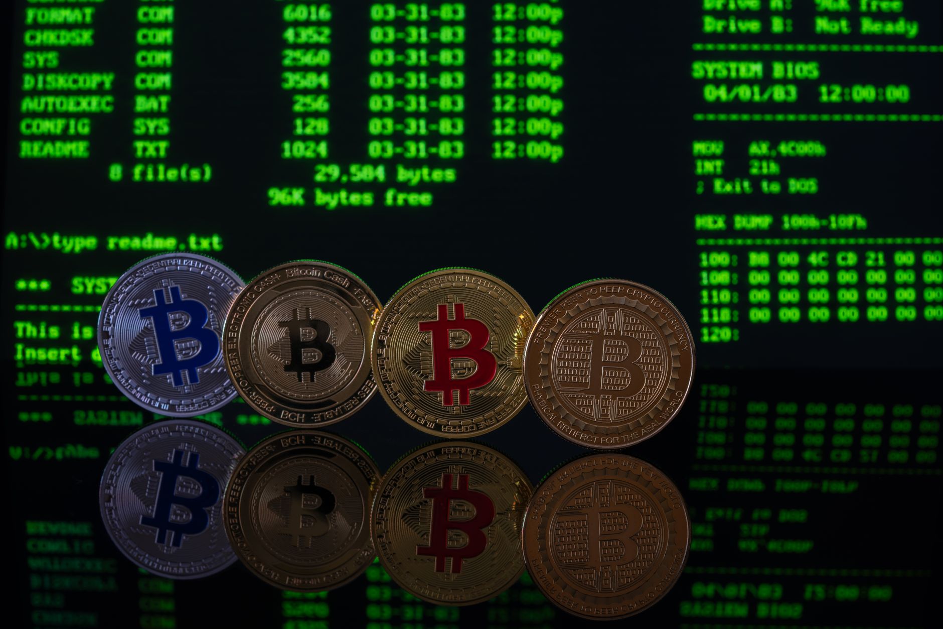 Reflective bitcoin coins on a table against a digital code background, highlighting cryptocurrency themes.