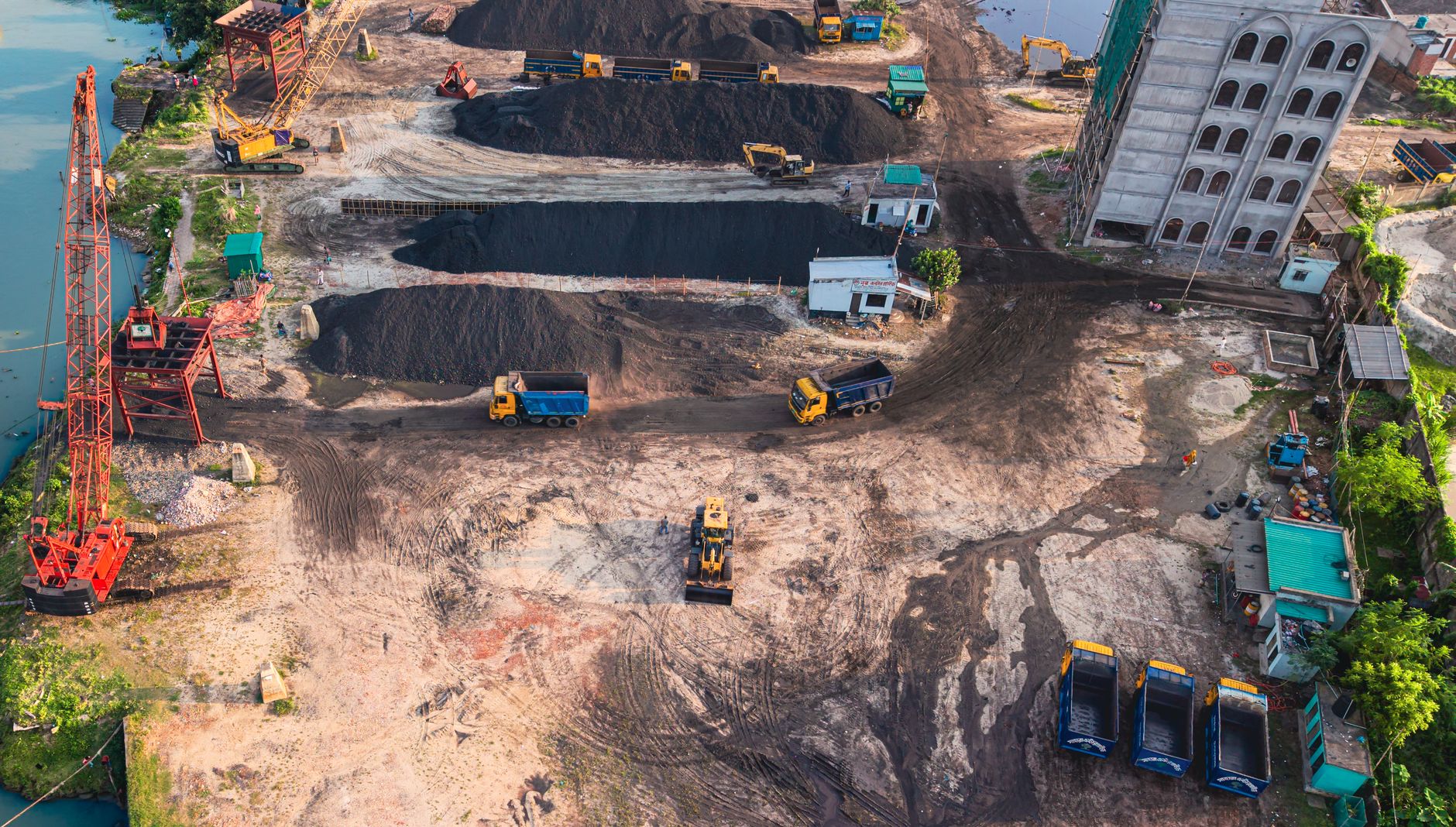 Aerial view of construction site with machinery in Dhaka, Bangladesh.